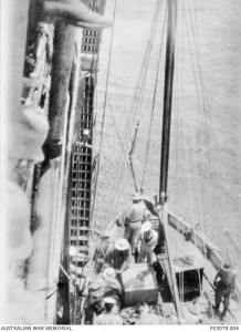 Members of the AN&MEF bringing Capt Brian Colden Antill Pockley on board HMAT Berrima. Image courtesy Australian War Memorial.