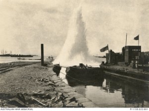 Turkish artillery bursting beside a pier constructed by the 1st RANBT at Suvla Bay, 1915. Image courtesy Australian War Memorial.