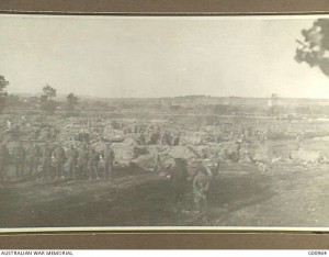 The 2nd Australian Infantry Brigade bivouac in wheatfields on the Gallipoli Peninsula, 6 May 1915. The Second Battle of Krithia is in progress on Achi Baba hill in the distance. CEW Bean. Image courtesy Australian War Memorial.