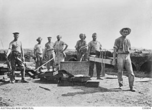 Bakers at the 1st Australian Field Bakery carrying a batch of newly baked bread, Imbros, 1915. Image courtesy Australian War Memorial.