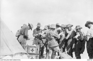 Men of the 21st Battalion receiving cholera vaccinations prior to leaving for Gallipoli, Egypt, 1915. Image courtesy Australian War Memorial.