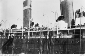 Southland an hour after being torpedoed on 2 September 1915. Most of the life boats have left the ship; some troops are still on deck. Image courtesy Australian War Memorial.