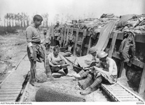Australian soldiers relaxing near Armentieres 1916. The soldiers on the right are chatting; extracting lice - chats – from their clothing. Image courtesy Australian War Memorial.